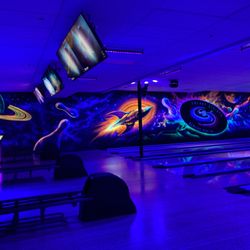 Galaxy Strikes Bowling Center - Lane 1 wall under black lights
