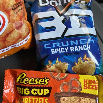 7-Eleven - a variety of snacks on a car seat - Convenience Stores Near Me - Moab, Utah