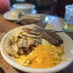 Kid's Breakfast scrambled eggs with cheese, potatoes and sausage links