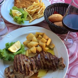 Steak with roasted potatoes, Breaded milanesa with fries Steak with roasted potatoes, Breaded milanesa with fries