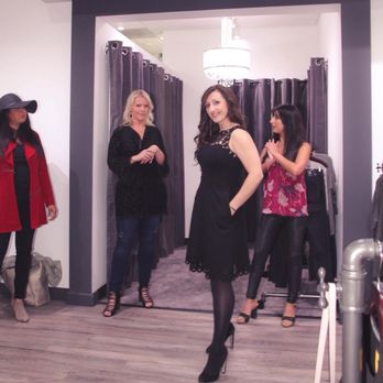 Divalani Style - Lovely model emerging from the fitting room suite to display a sexy black dress. - Women's Clothing Near Me - Tukwila, Washington