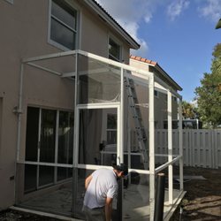 All Window & Door Repair - While we install new screen to a patio screen enclosure.