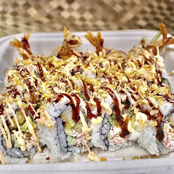 Poipu Poke Shack - a close up of a roll with sauce and toppings - Poke Near Me - Koloa, Hawaii Poipu Poke Shack - a close up of a roll with sauce and toppings - Poke Near Me - Koloa, Hawaii