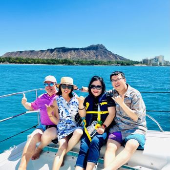 Hawaii Ocean Charters - Hangin' out in the bow on our way to the Snorkel Spot - Diamond Head in the Background - Whale Watching Tours Near Me - Honolulu, Hawaii