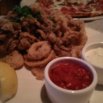 Yard House - Fried calamari - with marinara sauce and tartar sauce - New American Near Me - Atlanta, Georgia Yard House - Fried calamari - with marinara sauce and tartar sauce - New American Near Me - Atlanta, Georgia