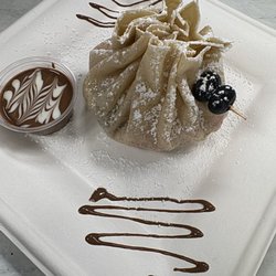 Crêpes N’ Berries - Experience the ultimate dessert fusion: brownie, ice cream, strawberry, and chocolate in one irresistible pouch crepe.
