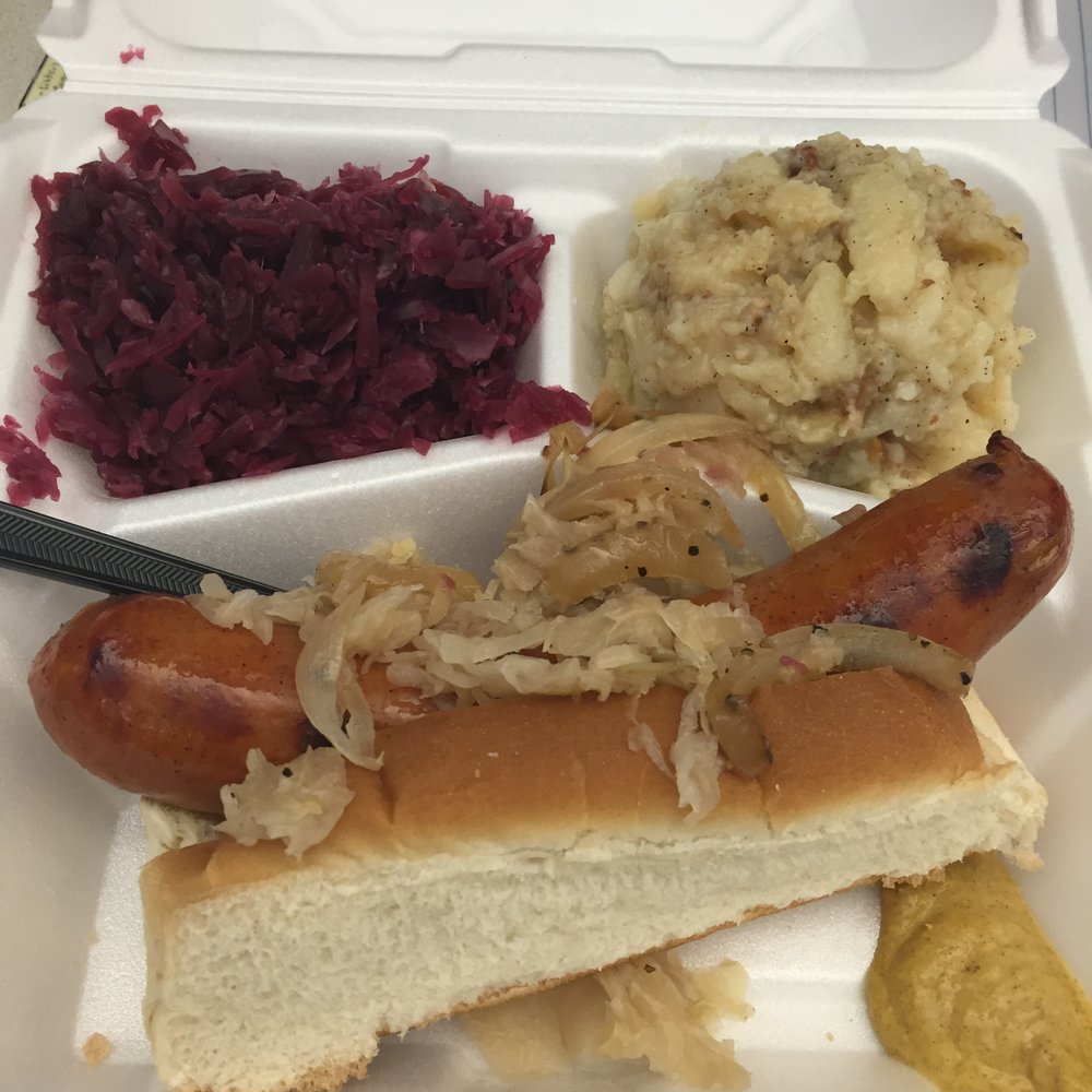 Schmidt’s Sausage Haus Catering - Bahama Mama topped with grilled onions and sauerkraut  2 sides: Hot Sauerkraut, & German Potato Salad - Food Trucks Near Me - Columbus, Ohio
