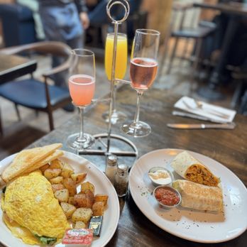Ketch Harbor Pub - Crab and Spinach Omelet house potatoes and sourdough toast.  Breakfast Buritto with a little crunch added.  Lastly a Mimosa Flight. - Seafood Near Me - Half Moon Bay, California