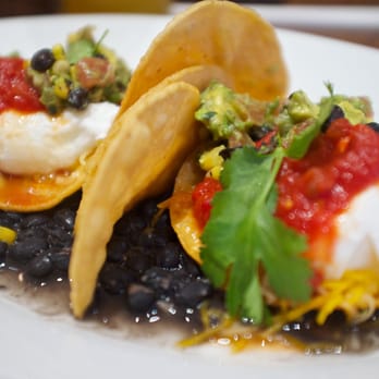 Carnation Cafe - Huevos Rancheros - Corn Tortillas, Poached Eggs, Jack Cheese, Fire-roasted Salsa, Avocado-Black Bean Pico de Gallo. $9.99 - American Near Me - Anaheim, California Carnation Cafe - Huevos Rancheros - Corn Tortillas, Poached Eggs, Jack Cheese, Fire-roasted Salsa, Avocado-Black Bean Pico de Gallo. $9.99 - American Near Me - Anaheim, California