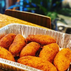 Mama Roc's Puerto Rican & Caribbean Cuisine - Insanely delicious Alcapurria (Puerto Rican golden fried fritter) made by Mama Roc!