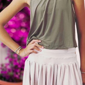 Lanethix - one of our happy customers wearing our pleated back top with the high low pleated tennis skirt in light pink - Sports Wear Near Me - San Diego, California Lanethix - one of our happy customers wearing our pleated back top with the high low pleated tennis skirt in light pink - Sports Wear Near Me - San Diego, California