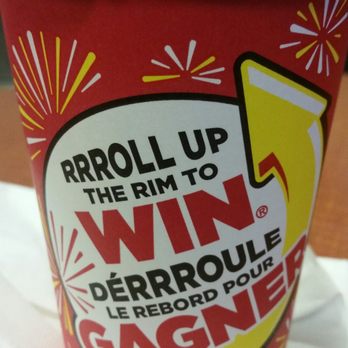 Tim Hortons - a red cup with the words roll up the rim to win - Coffee & Tea Near Me - Stouffville, Ontario