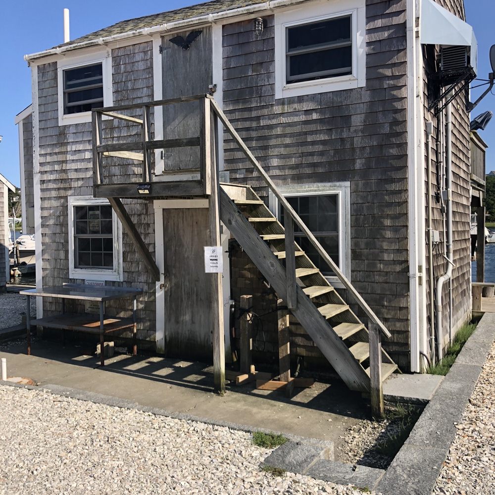 Chatham Shellfish - a beach house with stairs leading up to it - Seafood Markets Near Me - Chatham, Massachusetts Chatham Shellfish - a beach house with stairs leading up to it - Seafood Markets Near Me - Chatham, Massachusetts