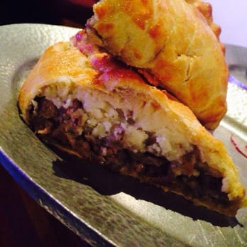 Cornish Pasty - Steak potatoes and onions, I like the mustard cream sauce with it - British Near Me - Las Vegas, Nevada