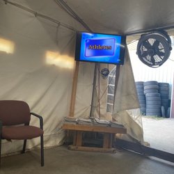 Road Runner Tire - Waiting area with Tv and good amount of seating behind me. Did not want to take a picture of other customers waiting or would have.