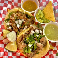 Lengua/ Beef Tongue and Suadero/Brisket tacos Fresh made guacamole, mild green and primo salsa.
