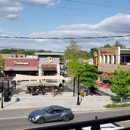 a view of a street from a balcony