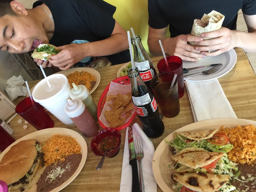 Every one having a feast. Tacos, torta, burrito, and gorditas Yelp