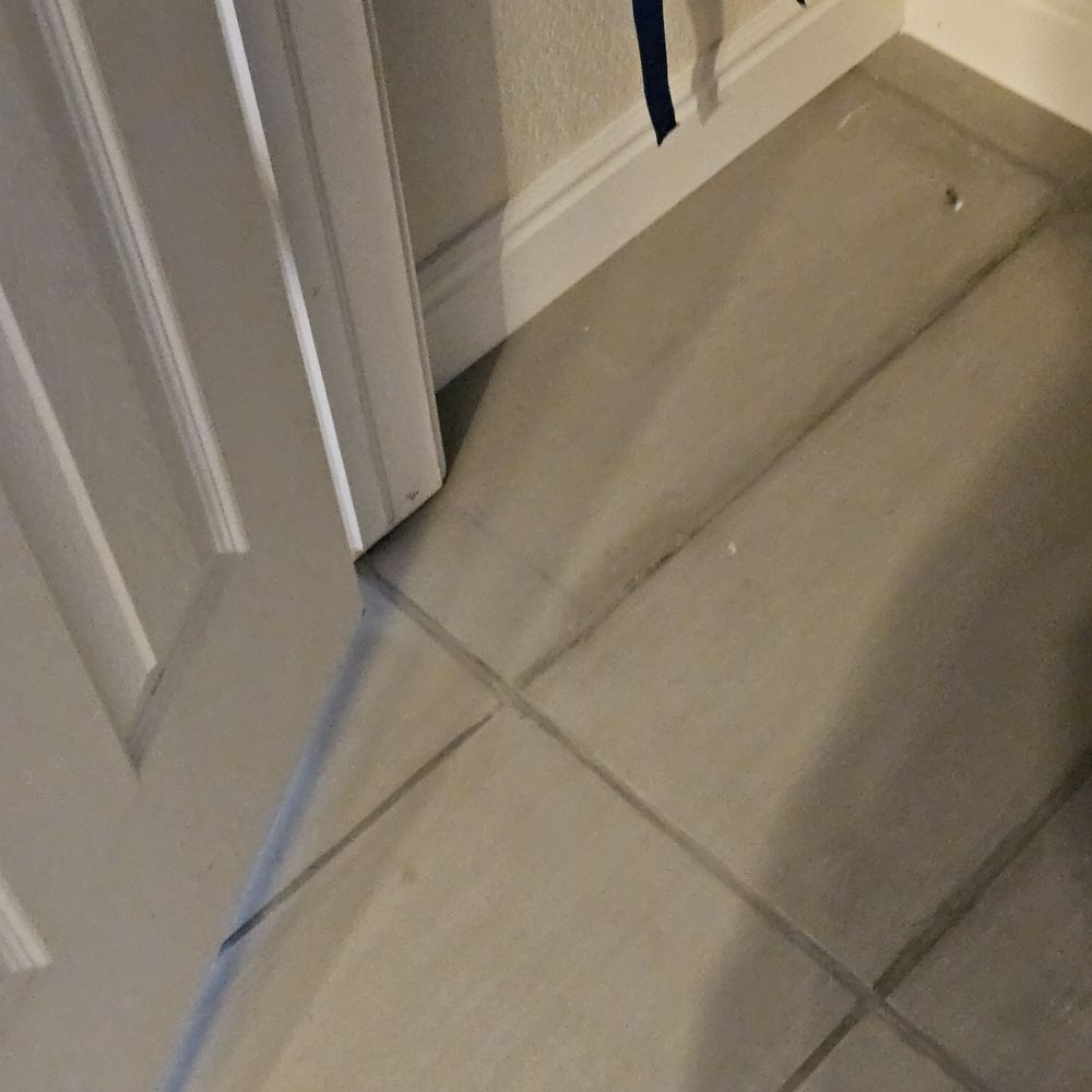 Anatom Restoration - This is BRAND NEW GROUT AND TILE.  What a mess!  Looks 20 years old and moldy. - Damage Restoration Near Me - Centennial, Colorado