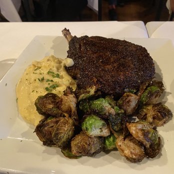 Theo's Steaks, Sides & Spirits - Rehoboth Beach - Bone in rib eye with mashed potatoes and Brussels sprouts - Steakhouses Near Me - Rehoboth Beach, Delaware Theo's Steaks, Sides & Spirits - Rehoboth Beach - Bone in rib eye with mashed potatoes and Brussels sprouts - Steakhouses Near Me - Rehoboth Beach, Delaware