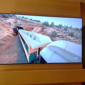 Wiredsmart Systems - Concealed wire TV mount over fireplace. - Home Network Installation Near Me