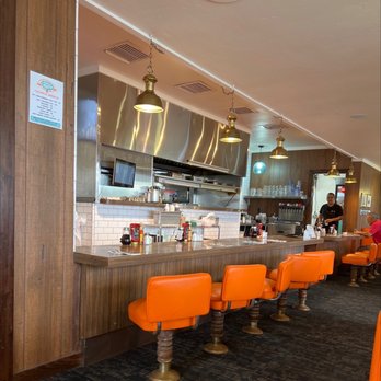 Dick Church's - a restaurant with orange chairs - Diners Near Me - Costa Mesa, California