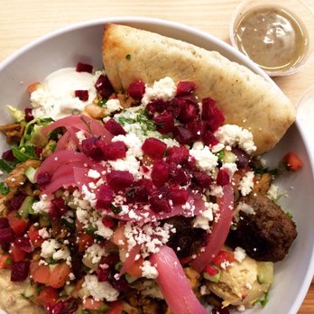 CAVA - Greens and grains bowl with chicken and beef meatballs. - Mediterranean Near Me - Irvine, California CAVA - Greens and grains bowl with chicken and beef meatballs. - Mediterranean Near Me - Irvine, California