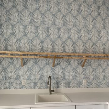 Sand & Fog Design - a kitchen with a sink and shelves - Interior Design Near Me Sand & Fog Design - a kitchen with a sink and shelves - Interior Design Near Me