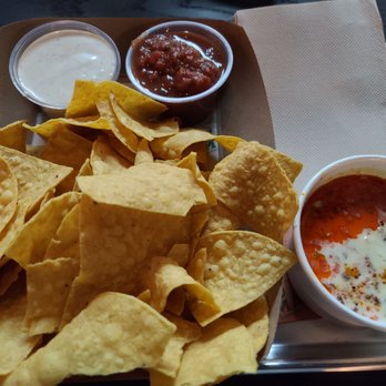 Y Tu Mama - White sauce and red salsa on the top. Chori dip on the bottom right. - Mexican Near Me - Richmond, Virginia Y Tu Mama - White sauce and red salsa on the top. Chori dip on the bottom right. - Mexican Near Me - Richmond, Virginia