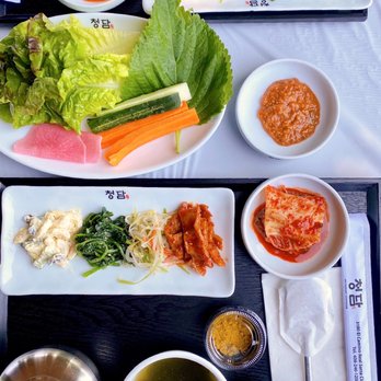 Chungdam - COVID-19 Patio Dining: Individual trays w/ banchan, seaweed soup, multigrain rice, and ssäm. - Korean Near Me - Santa Clara, California Chungdam - COVID-19 Patio Dining: Individual trays w/ banchan, seaweed soup, multigrain rice, and ssäm. - Korean Near Me - Santa Clara, California