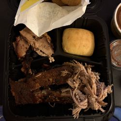 Dickey's Barbecue Pit - Lancaster - 3 meat combo with sliced brisket, pulled pork, and pork ribs. The photo makes the portion look more generous than it was. Not worth $35.