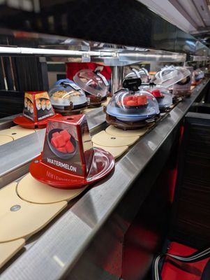 Kura Revolving Sushi Bar by null