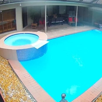Romance Pools - Before! Deteriorated itchy fiberglass liner; old dilapidated tile, uneven ugly concrete deck and dirty rock bed. - Pool & Hot Tub Service Near Me