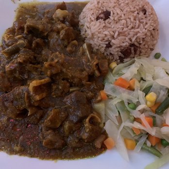 Fish N' Ting - Curried goat with rice and peas and steamed veggies. - Caribbean Near Me - Bronx, New York Fish N' Ting - Curried goat with rice and peas and steamed veggies. - Caribbean Near Me - Bronx, New York