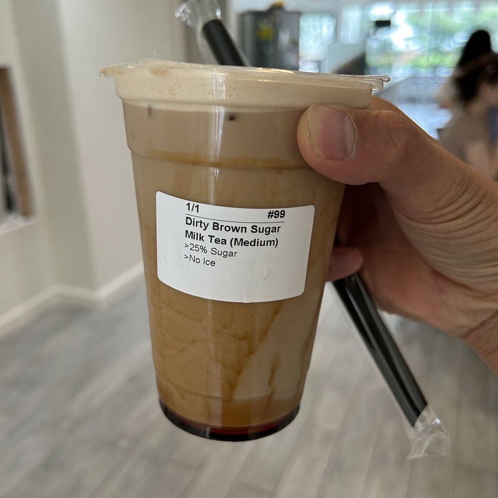 Fusion Ti - a hand holding a cup of iced coffee - Desserts Near Me - Livingston, New Jersey Fusion Ti - a hand holding a cup of iced coffee - Desserts Near Me - Livingston, New Jersey