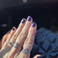 Paradise Nail and Spa - Chrome gel nails with white star details.