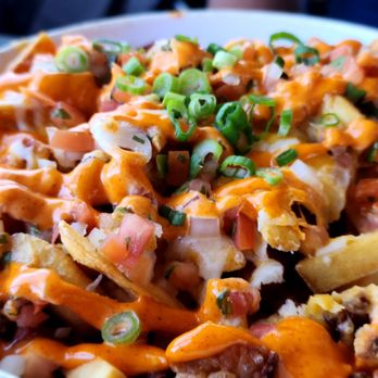 O'Brien's Pub - Pork Belly Fries Crspy beer braised pork belly, smoked cheese, Big Nate sauce, salsa fresca, scallions - Pubs Near Me - San Diego, California O'Brien's Pub - Pork Belly Fries Crspy beer braised pork belly, smoked cheese, Big Nate sauce, salsa fresca, scallions - Pubs Near Me - San Diego, California