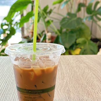 Phin - a cup of iced coffee on a table - Coffee & Tea Near Me - Seattle, Washington Phin - a cup of iced coffee on a table - Coffee & Tea Near Me - Seattle, Washington