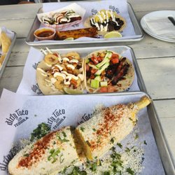 Mr Tacos - Street Corn,sweet plantains, Calamari, Jamaican jerk, pork belly, and barria tacos.