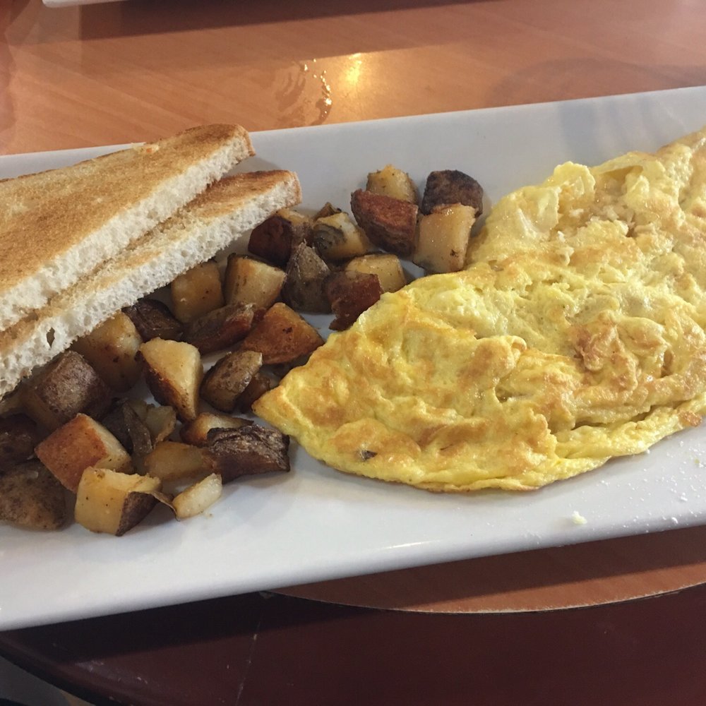 Black Cat Cafe - A three cheese omelette, home fries and toast (from someone else's plate). - Coffee & Tea Near Me - Irvington, New York Black Cat Cafe - A three cheese omelette, home fries and toast (from someone else's plate). - Coffee & Tea Near Me - Irvington, New York