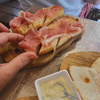 Alto do Bairro - This is the itty bitty ham and cheese bread. It did taste good but they really don't give you much food. - Tapas Bars Near Me - Lisbon, 11
