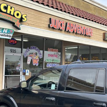Juice Adventure - a black suv parked in front of a juice adventure - Juice Bars & Smoothies Near Me - Chula Vista, California