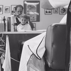 Shippan Ave Barber Shop - Mike and his happy little customer.