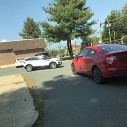 US Post Office - The red car approached and couldn't get out. We all had to sit there until she came back to her car and pulled out - slowly. Jerk!