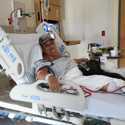 Samer Ghostine, MD - At Riverside Hospital after my back surgery. My Zoey with me. (that little black thing on the bed)