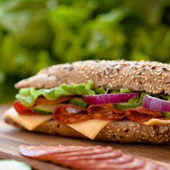 Marcello's Market & Deli - a sandwich on a cutting board - Delis Near Me - Toronto, Ontario Marcello's Market & Deli - a sandwich on a cutting board - Delis Near Me - Toronto, Ontario