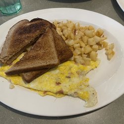 Curly's Family Restaurant - Ham and cheese omelet with home fries and wheat toast