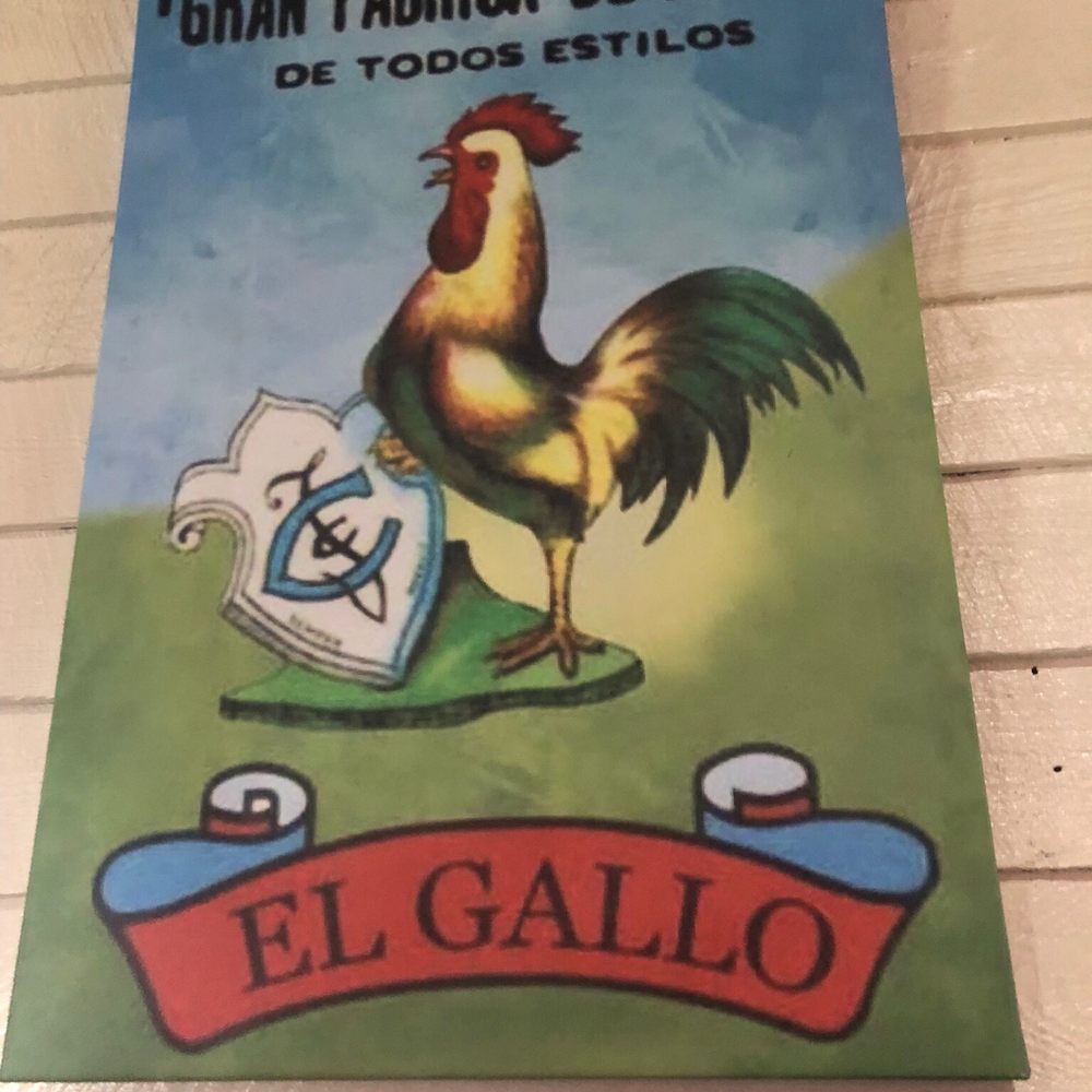 a rooster on a sign