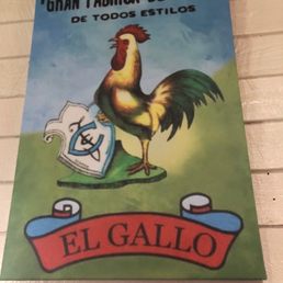 a rooster on a sign