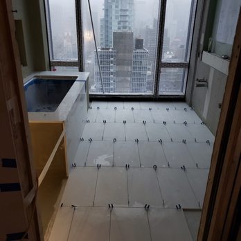 Creative Tile - a bathroom with a view of the city - General Contractors Near Me - Rocky Point, New York Creative Tile - a bathroom with a view of the city - General Contractors Near Me - Rocky Point, New York